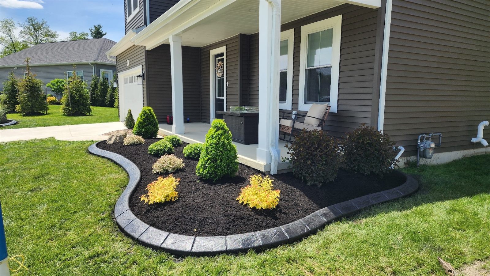Decorative curbing around a landscaped bed