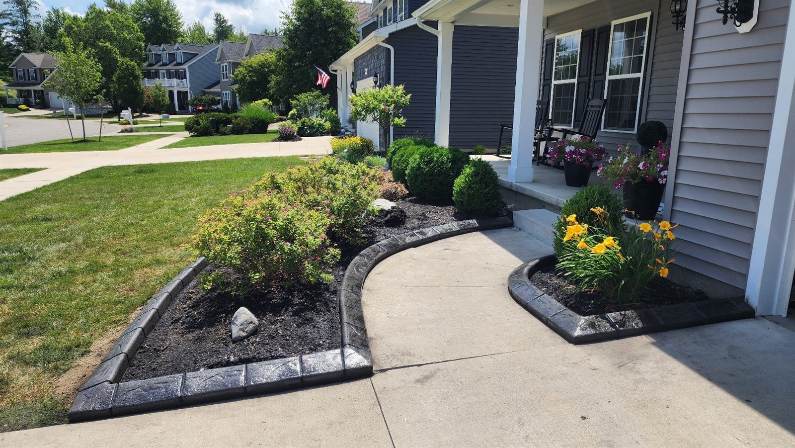 Decorative curbing along a front walkway